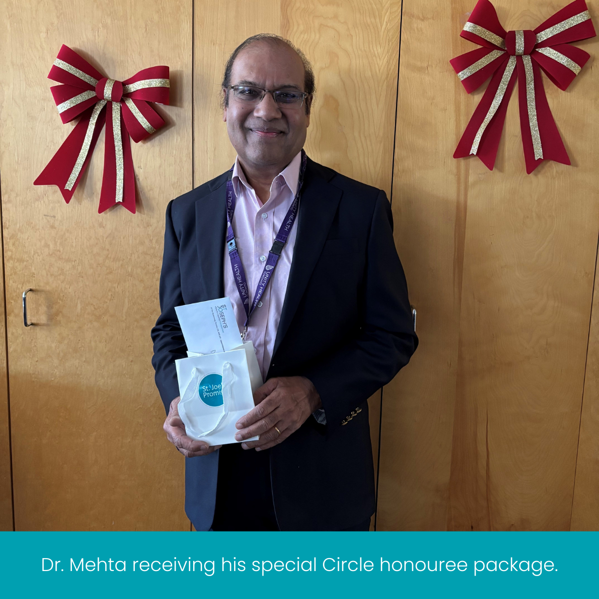 Dr. Mehta receiving his special circle honouree package. (2)