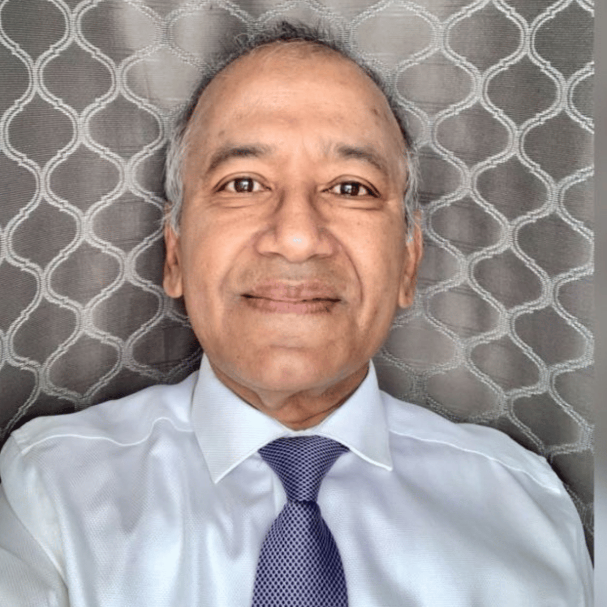 Mahbub smiling at the camera